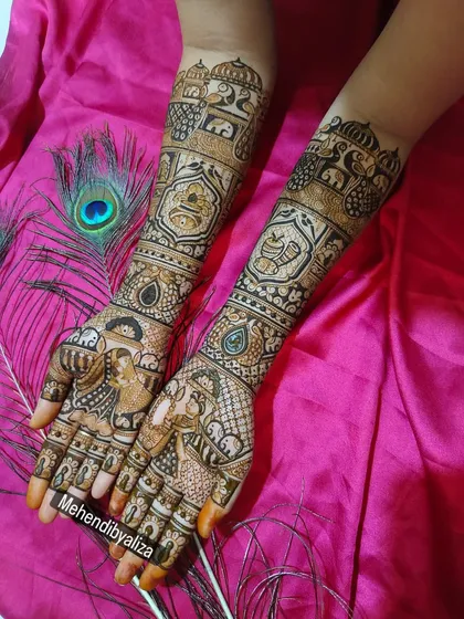 Another angle of the portrait bridal mehendi, showing the intricate details on the arms and the beautiful symmetry between both hands.