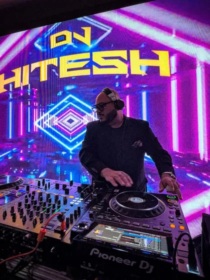 In my element, turning love stories into a non-stop musical journey. With a massive LED backdrop and the right tracks, I make sure your wedding day is unforgettable.
