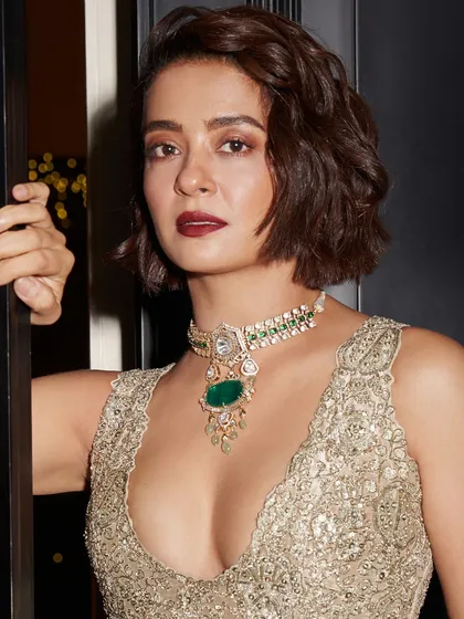 Surveen Chawla's powerful presence is matched by the bold design of our emerald pendant necklace, a piece that commands attention.