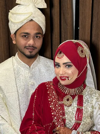 A final portrait of this stunning couple. The bride's Hijabi bridal look is a testament to how elegance and tradition can be beautifully combined.
