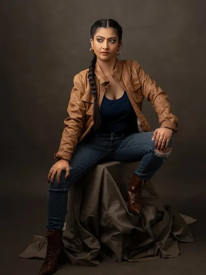 This look is all about grit and attitude. The leather jacket, ripped jeans, and intense expression create a tough, edgy character, adding another layer of range to her actor portfolio.