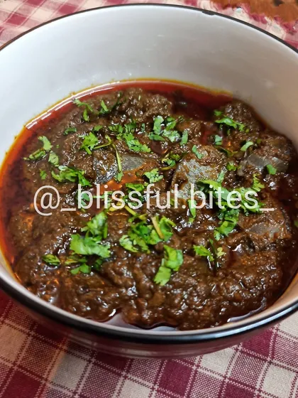 My Tilli Gravy is a dish for those with an adventurous palate. I cook goat spleen in a thick, spicy, and deeply flavorful curry. It's a traditional dish known for its rich taste and nutritional benefits.