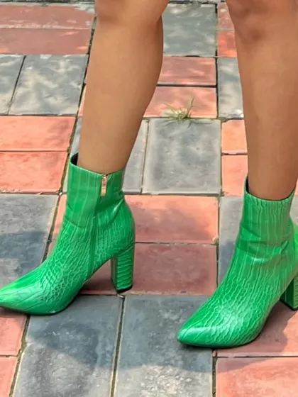 Sometimes, the shoes are the entire statement. These vibrant green, crocodile-textured ankle boots are a perfect example of how a bold accessory can define a look. No regrets.