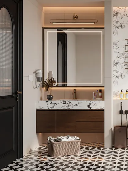 The vanity area in this bathroom features a dark wood cabinet and a large, backlit mirror, set against a bold, graphic floor.