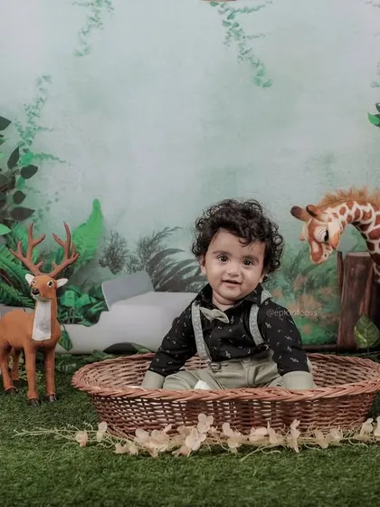 Welcome to the jungle. Our 'Wild One' themed shoot is perfect for adventurous toddlers, complete with a lush backdrop and friendly animal props for a fun and imaginative safari experience.