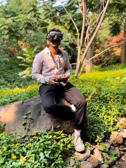 A behind-the-scenes photo of me in my element, surrounded by nature. For me, FPV is a portal to boundless creativity and a reminder that life has no limits.