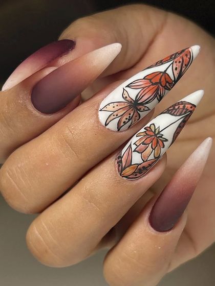Another angle of the stunning autumn-themed nail art, showcasing the detailed line work and coloring of the hand-painted leaves.