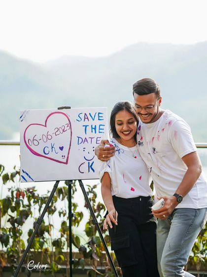 The happy result of a paint-splatter "save the date" shoot, full of genuine laughter and color.
