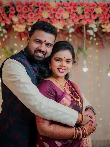 A joyful hug from the groom makes the bride light up with happiness. This candid shot perfectly captures the celebratory and loving atmosphere of their engagement.