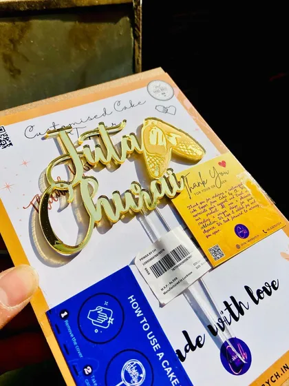 The "Juta Churai" topper in its packaging, complete with instructions, ready for the fun and games of a wedding.