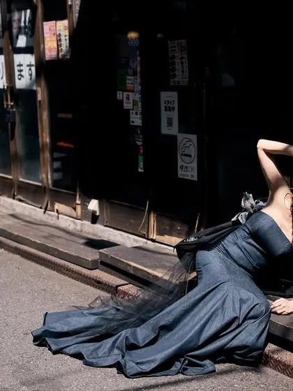 Using the harsh midday sun to our advantage in a Tokyo alley. The deep shadows create a dramatic, high-contrast scene, carving the model out from the background. This is how you make natural light work for you.