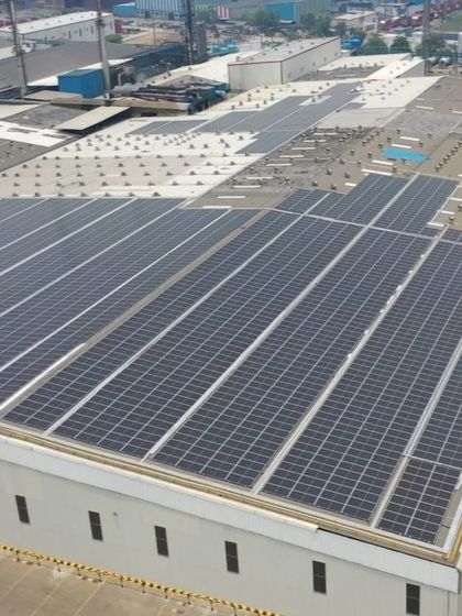 This image shows another angle of the extensive solar panel array on the Coca-Cola facility roof. Our engineering team carefully plans each layout to account for roof obstacles and optimize sun exposure throughout the day.
