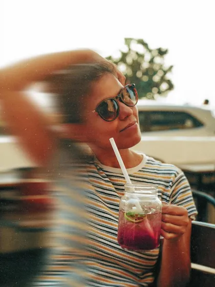 An experimental shot using a slow shutter speed to create motion blur. This adds an artistic and dynamic element to a simple portrait.