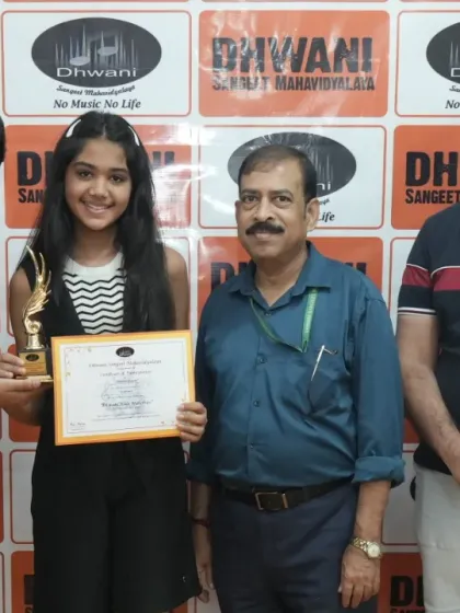 Our instructors and gurus with a talented student. This highlights the supportive Guru-Shishya relationship that is central to our teaching philosophy, ensuring personalized guidance in your fitness journey.