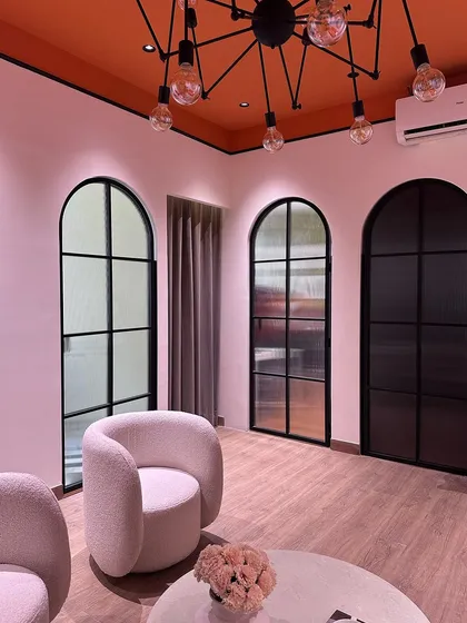 A look at the series of custom arched doors that divide the spaces in my studio. I used a mix of fluted and clear glass in black metal frames to maintain an open feel while providing visual separation and texture.