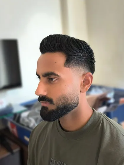 A closer look at the sharp fade and styled quiff for Naman Dhir. A sleek and bold look perfect for the IPL vibe.