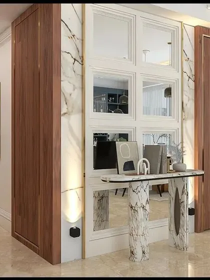 Our proposed design to conceal the utility doors. We introduced a concept with wood and marble paneling, a mirrored console area, and a new, modern main door to create a grander entrance.