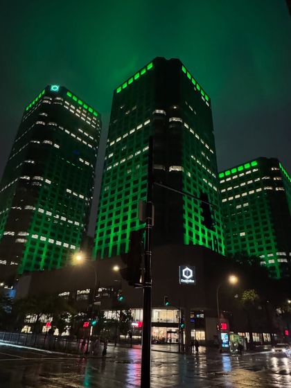 An architectural shot of downtown Montréal at night, capturing the city's vibrant green-lit buildings. This shows I also capture location-focused B-roll.