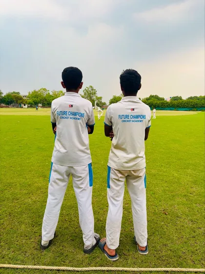 Another shot of our inseparable duo, watching the game from the sidelines.