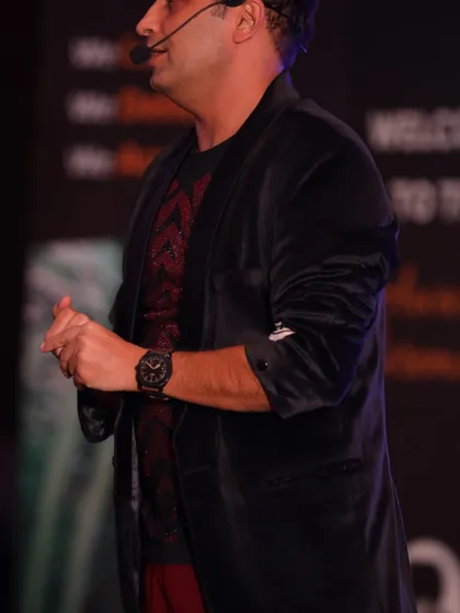 Speaking to the audience during the Balrampur Chini Mills event. Clear communication and a strong stage presence are key to a successful corporate performance.