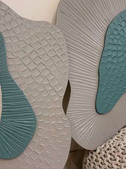 A shot that captures the relationship between the two separate pieces of the diptych, showing how they are designed to complement each other in form and texture.