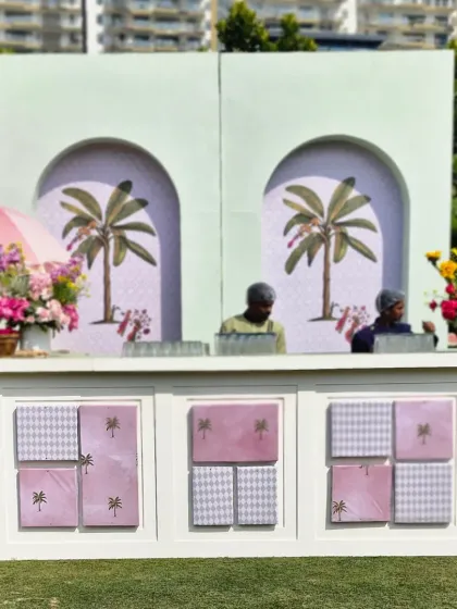 The bar in action, ready to serve guests. The design integrates seamlessly with the garden setting, providing a central point for socializing.