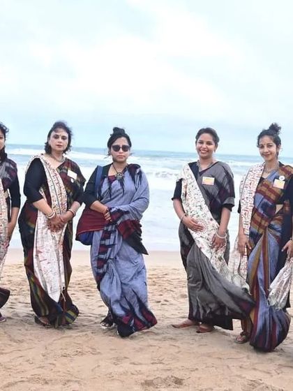 A group of participants in beautiful traditional sarees on the beach at Puri. Our yatras are also a celebration of our culture and the joy of shared experiences.