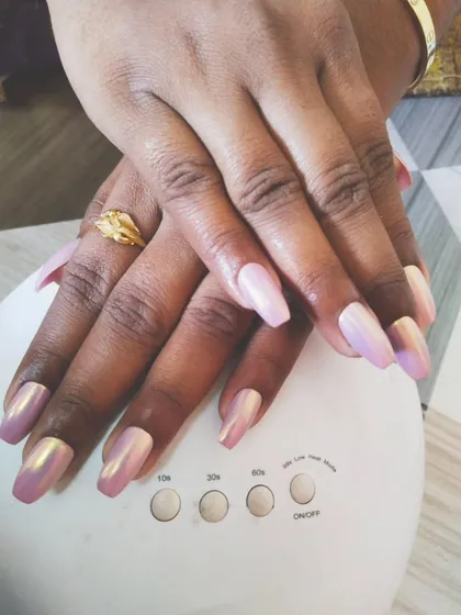 You can never go wrong with a beautiful chrome finish. Here, I've applied a stunning iridescent pink chrome powder over coffin-shaped gel extensions. The way it catches the light is just amazing, and it’s all cured perfectly under my portable UV lamp.
