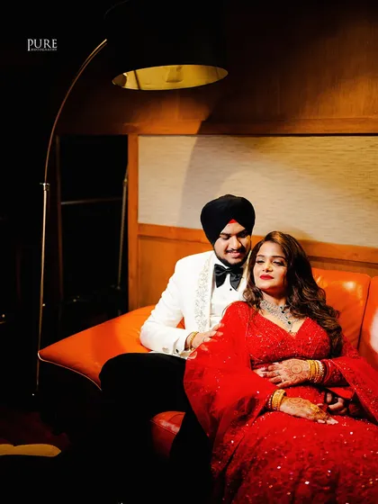 Another beautiful shot from the couple's reception portrait session. The floor lamp adds a touch of modern elegance to the scene.