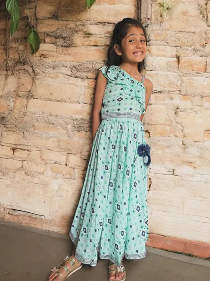 For the little girl with a big personality. This one-shoulder chaniya choli set in a lovely mint green is designed to be as unique and spirited as she is. It’s all about feeling confident, comfortable, and ready for any celebration.