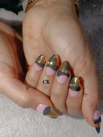 Another look at the pink, black, and gold chrome abstract design.