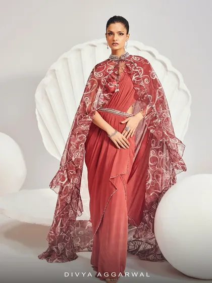 A full-length view of the Serena Saree Set, where the dramatic printed cape flows over a pre-draped saree for a look of modern majesty.
