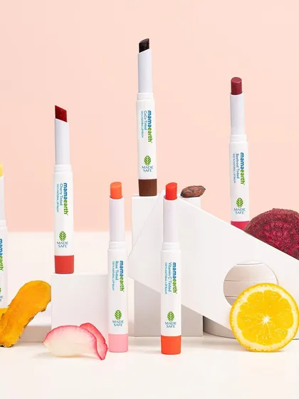 An alternate angle of the Mamaearth lip balm collection, showcasing the variety of shades and ingredients. This comprehensive shot is perfect for e-commerce banners and collection launches.