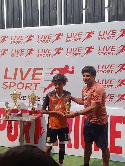 A player from our U11 team receives his award at the Junior League ceremony.