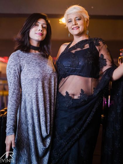 Two stylishly dressed guests.