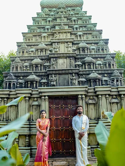 A magnificent temple gopuram replica serves as a grand and spiritual backdrop, ideal for traditional photoshoots, adding a sense of heritage and scale.