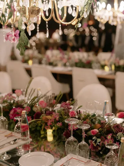 A finale dinner planned to perfection. This tablescape shows our meticulous attention to detail, from the color palettes and fresh floral arrangements to the specific glassware and crockery chosen to create a cohesive, luxurious dining experience.