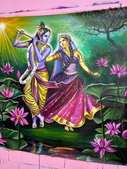 A different angle of the completed Radha Krishna painting, showing the texture of the canvas and the richness of the acrylic paints.