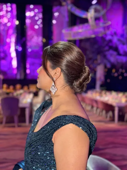 A side view of the twisted bun, showing how it complements the neckline of the gown.