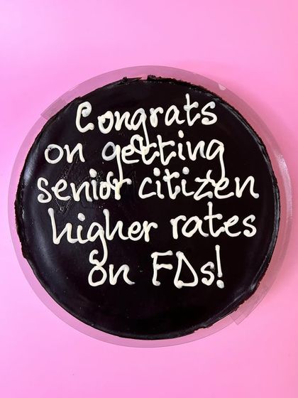 Who needs high interest rates when you can have a delicious cake? A funny custom cake to celebrate a milestone birthday and the financial perks that come with it.