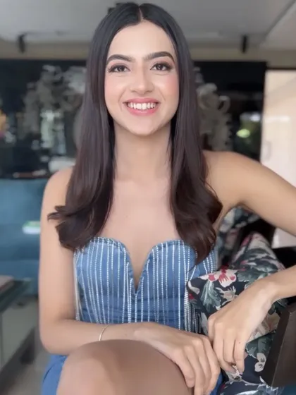 A candid shot showing her natural beauty enhanced by the makeup. This look is designed to be flattering in any lighting, which is crucial for public events.