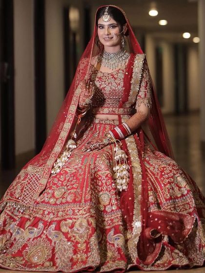 My bride looks so serene and beautiful. The full red lehenga with the double dupatta makes for such a royal and complete bridal look.