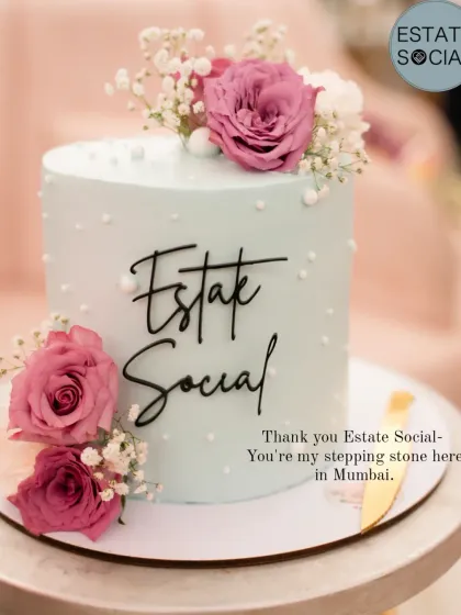 A beautiful pastel blue cake created for an "Estate Social" event, decorated with fresh pink roses and baby's breath.
