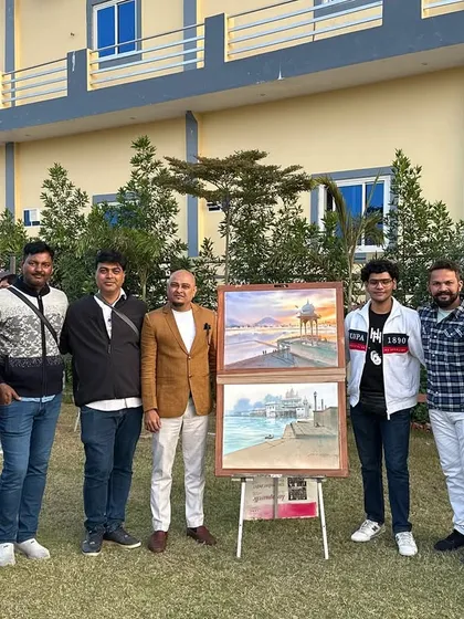 A group of fellow artists and organizers at the National Artist Camp in Ajmer, with my Pushkar paintings displayed.