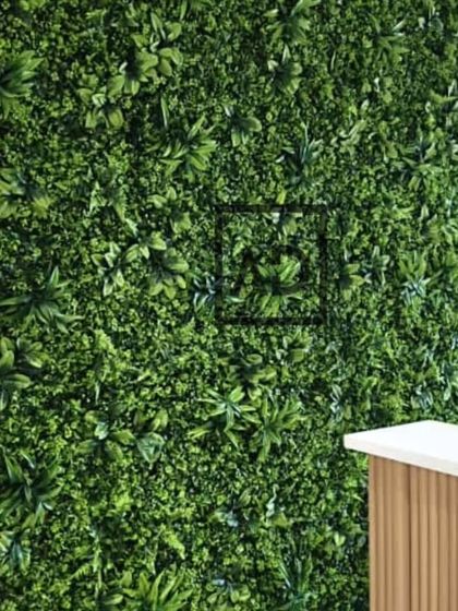 A closer view of the artificial vertical garden panel next to the fluted wood-look panels. This combination is perfect for bringing a natural yet polished element into office or commercial interiors.