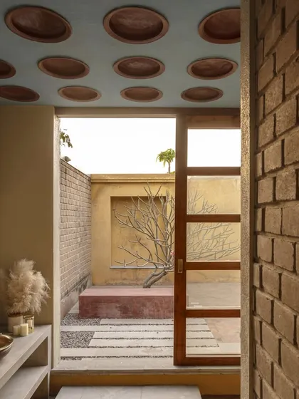 Sustainability is at the heart of our work. In this bathroom at Kaattu Veedu, we used locally sourced terracotta pots as fillers in the concrete slab ceiling, reducing concrete usage and adding a unique textural element that connects to an open air courtyard.