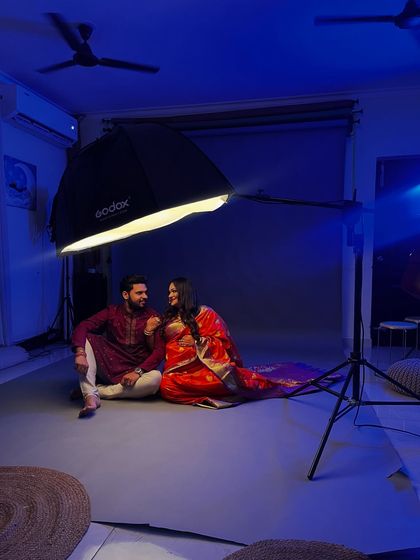 A wide shot showing our studio setup for a traditional maternity shoot. We create a comfortable space for you to relax and enjoy the experience.
