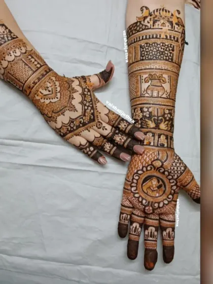 This bridal design combines different elements on each hand. One hand features a bride portrait within a circular frame, while the other showcases traditional patterns and wedding symbols like the kalash.