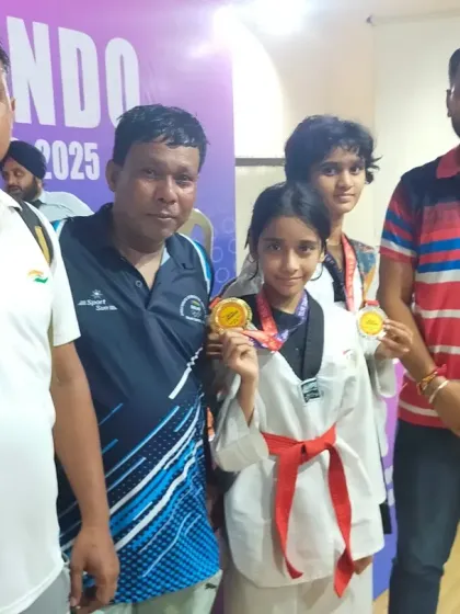 Our young medalists proudly showing their gold and silver medals from the Delhi State Championships.