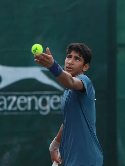 Tavish Pahwa's service toss and focus before a serve. The serve is a critical weapon, and we dedicate significant time to perfecting its technique and consistency.